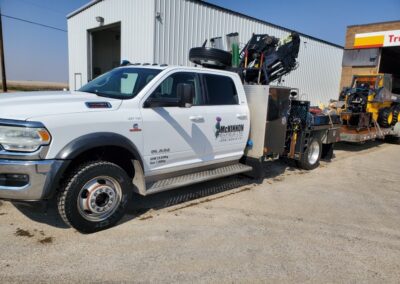 McKinnon Oilfield Equipment crew truck and Skid Steer